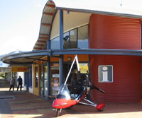 a gyrocopter parked outside Atherton Visitor Information Center