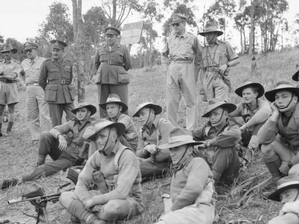 General Douglas watching a training exercise by the Australian 9th division on the Atherton Tablelands in WWII. Also seen is Lieutenant-General Morshead