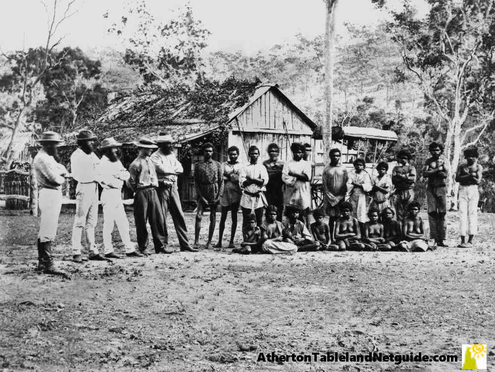 Group of aboriginals and European men in front of bush shack somewhere in north Queensland in the 1860s.