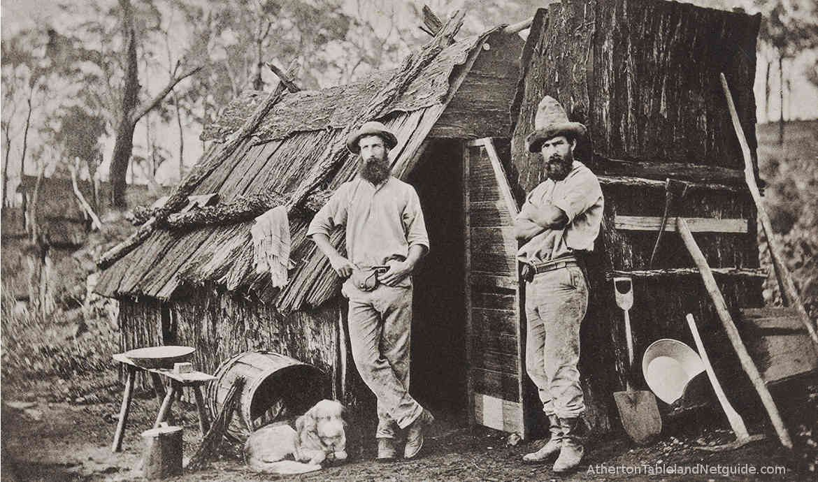 Two men standing outside a bark hut in north Queensland circa 1868