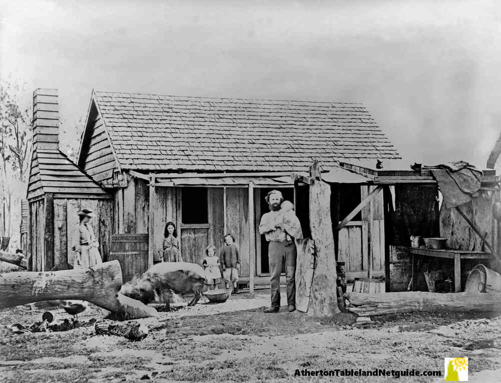 Farmer and family outside slab hut in Queensland around 1870