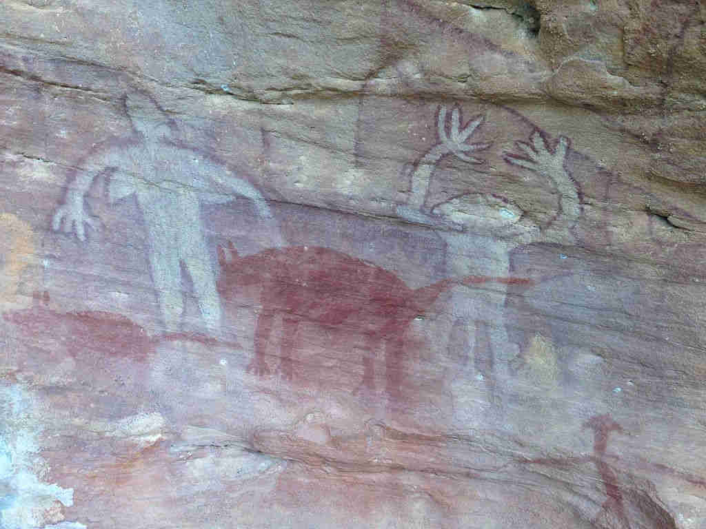 An aboriginal rock painting at Split Rock, Laura, far north Queensland showing dingos and spririt beings